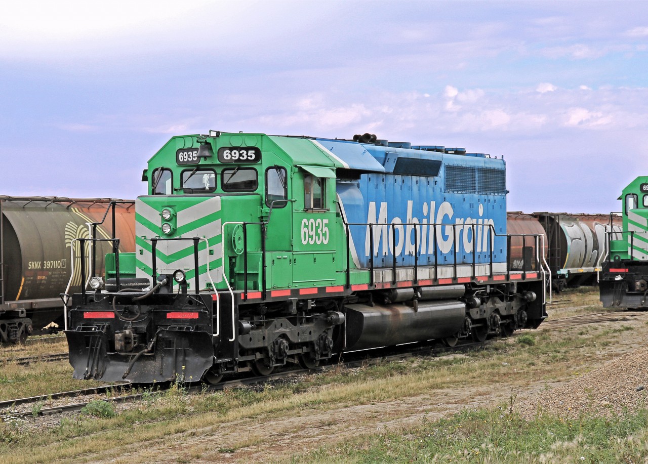 Not Working on this day.  Mobil Grains SD40-3 6935 sits silently in the yard at Aylesbury.