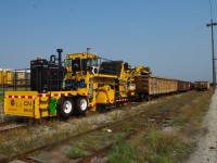 Not everything that moves railcars is from GM or GE. With operator orientation, air brake and car coupling/movement training complete, CN 686-34 a brand new Knox Kershaw KYC550 yard cleaner is ready to start work.  We have just coupled to gondola WC 54226 and will move it over one track in order to get at CN 188314 which will be an assigned car for the new machine. Over time, cargo shakings from a variety of shipments such as grain, plastic pellets, potash, and other commodities sift from cars and collect in the yard tracks. After a pass with the KYC550 these tracks they will be clean right down to the wood.
