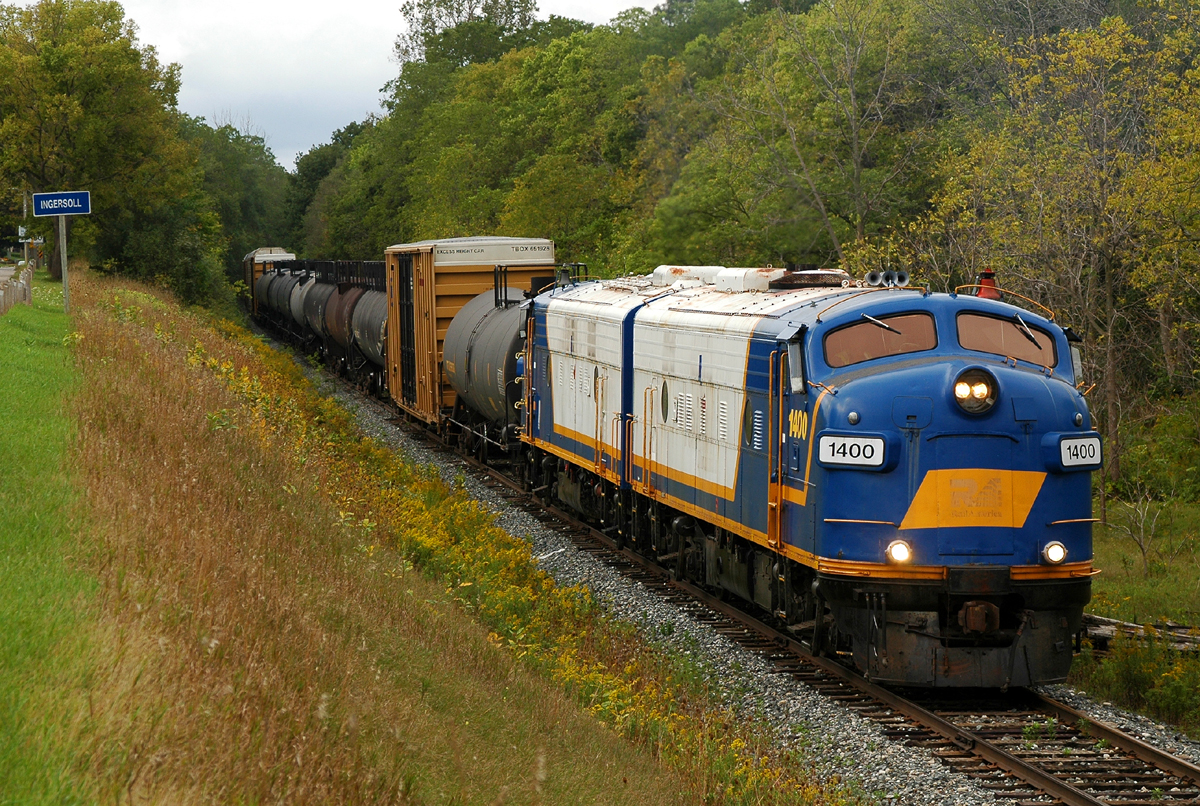 Matching OSR FP9A's 1400 (CN 6539) and 1401 (CN 6523) roll east through Ingersoll, ON with 31 cars for interchange with CP at Woodstock