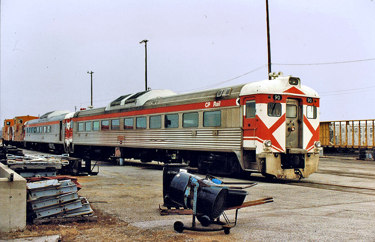 Canadian Pacific Dayliner #90 & sister, along with two extended vision cabooses, sits at CP's Agincourt Yard, Toronto, ON. No longer in revenue service, by this time these units were used to transport maintenance-of-way employees. For more pics & video from my collection see my website at  http://northamericabyrail.info  , Cheers, Pete