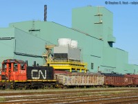 <b>What year is this - part one: </b> CN 7304, SW1200 repaired in the spring and sent to Hamilton is now doing duties at the Hamilton Steel Centre - located between Ottawa St and Parkdale Ave in Hamilton. In the background is Dofasco Central Shipping. This is 2015? Pinch me. <br><br>Notes on repairs: Repairs performed at LDS in Sarnia, engine recieved a new block.