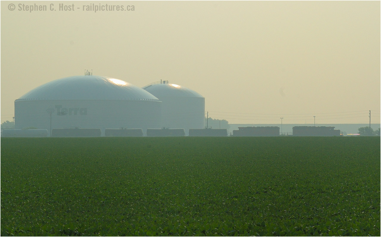 Back to my oldies... 10 years ago, CSX D725 (Sarnia, Ontario to Chatham, Ontario turn) is Southbound on the Sarnia Subdivision at around mile 53, with 49 cars in tow and two CP SD40-2's for power, which were run-through, as part of the agreement with CP. This train became CP 522 at Chatham, where CP delivered the train to CSX in Detroit and I believe the train continued to Toledo over CSX Rails. 

At this time, D725 ran six days a week (mon-sat) and two days a week it brought a pair of CSX engines to Chatham for D724 (Chatham to Blenheim, back to Sarnia) - when I arrived at Chatham later that morning, I noted two engines waiting for a D724 ( 2570 and 2690) - so I was in luck, two jobs on the road in one day. I spent a lot of time documenting the Sarnia Subdivision operations during this time, it was on borrowed time and we all knew it - this place was like a time machine right out of the 70's..