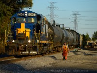 Summer's officially over as of tonight, and in the last rays of a late Summer sun, SOR 495, aka 1900 HAM yard switcher is at the far end of the "hole" - Parkdale Ave in Hamilton switching A&M metals. The Conductor (and RPCA member angelok) is walking up to the train after coupling cars to perform switching in the yard behind me. This is a place I have been to numerous times since 1998, first as an employee of a local metals recycler (summer job) later, as a railway and Hamilton enthusiast, these gritty dusty areas are what I like the most and where I spend a lot of my photography time. I'm a Hamilton fan, and the North End is where it's at.<br><br>Note the recent right of way work - a year ago this was weedy and rickety - A&M is expanding rapidly and it would appear as if they may lay a new spur is to be placed in the graded area at right - A&M is up to about 10 to 20 cars a day  and now sports a red Trackmobile. <br><br><b>Bonus & History of the area: </b>A photo looking the other way <a href=http://www.railpictures.ca/?attachment_id=17437 target=_blank>here</a> but sadly, the engine in THAT photo was scrapped. See the smokestack at background? That's the old water treatment plant, which used to be served by this spur, now served off the Grimsby Sub once a month or so - the change was made when Burlington St was built and elevated in the late 60's or so.