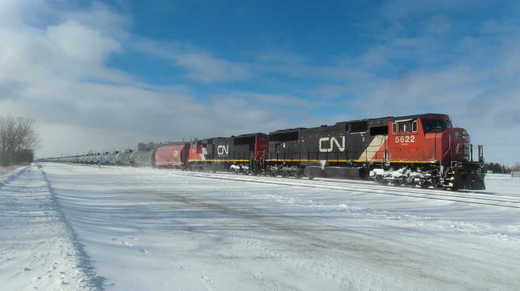 A pair of EMD units lead a tank train.