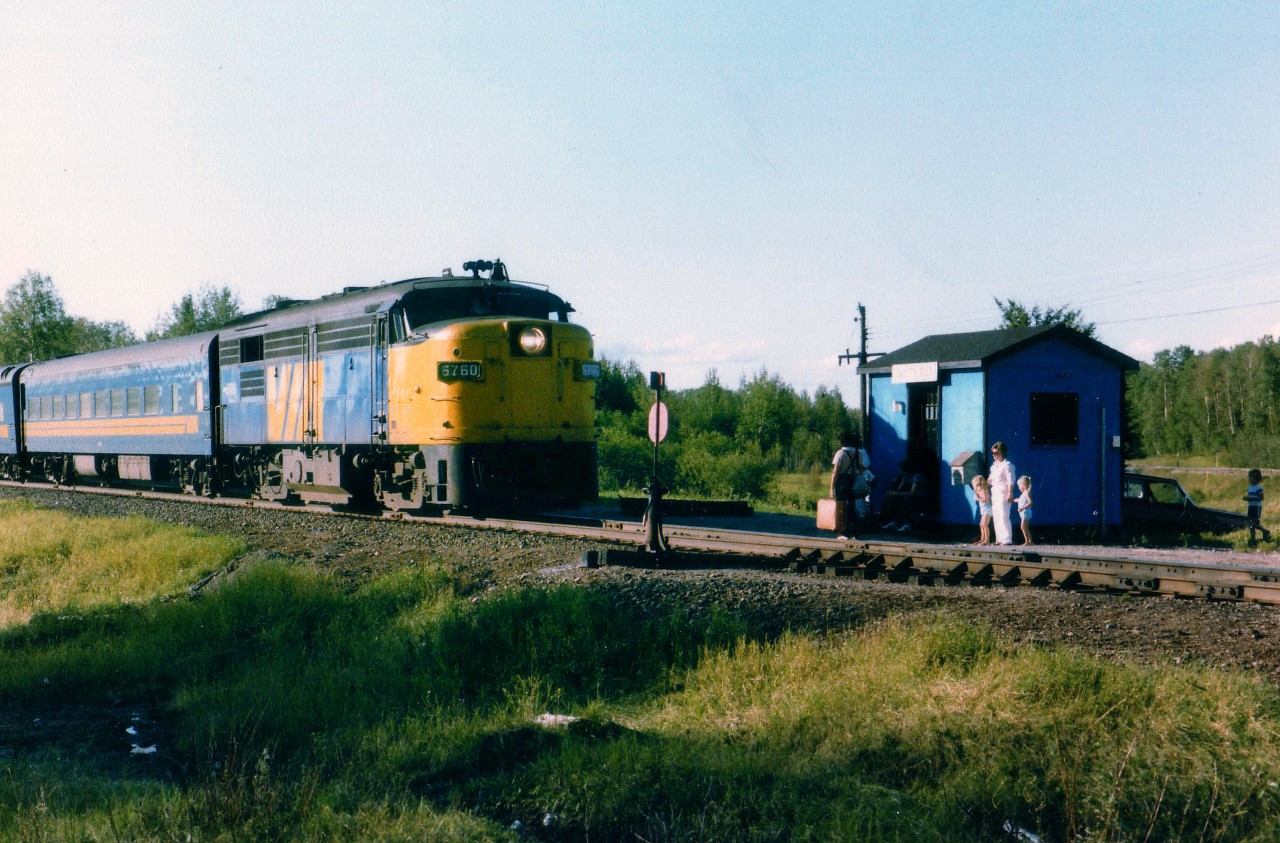 Just another old VIA photo, I suppose, but this location is far removed from most places today's fans would bother with. For one thing, the VIA, thanks of course to Mulroney Cuts of 1990, no longer frequents this line. VIA 6760,with 2 coaches in tow,is slowing to stop for passengers at the remote Smooth Falls Jct station. This train, from Kap to Cochrane, was once an extension of the now defunct ONR Northlander. There was just no population base to support this train, and with the government, need of money savings trumps necessity of citizens. Barely visible behind the 'waiting shack' is the reason for the Junction; the (also defunct) Mattagami Railroad line running up to the town of Smooth Rock Falls and its' once booming pulp and paper mill. Eastbound train with a western sunset made for difficult photography, but nowhere near the aggravation of dive-bombing mosquitos operating with the intensity of mad hornets. Looking at this photo, it suggests Notherners are almost immune to these pests. Not me. I hid in the car until I saw the headlight approaching. :o)