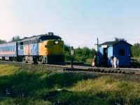 Just another old VIA photo, I suppose, but this location is far removed from most places today's fans would bother with. For one thing, the VIA, thanks of course to Mulroney Cuts of 1990, no longer frequents this line. VIA 6760,with 2 coaches in tow,is slowing to stop for passengers at the remote Smooth Falls Jct station. This train, from Kap to Cochrane, was once an extension of the now defunct ONR Northlander. There was just no population base to support this train, and with the government, need of money savings trumps necessity of citizens. Barely visible behind the 'waiting shack' is the reason for the Junction; the (also defunct) Mattagami Railroad line running up to the town of Smooth Rock Falls and its' once booming pulp and paper mill. Eastbound train with a western sunset made for difficult photography, but nowhere near the aggravation of dive-bombing mosquitos operating with the intensity of mad hornets. Looking at this photo, it suggests Notherners are almost immune to these pests. Not me. I hid in the car until I saw the headlight approaching. :o)