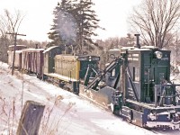 Pity the poor fellow standing on the front of EMD SW1200RS #1289 on this winter's day.

This image was taken circa 1960.  There was quite a bit of damage on the original slide.  I hope that you'll agree that state-of-the-art digital scanning and a touch of Photoshop has restored the image to acceptable standards.

Del's sister, Gloria, recently mailed me a package of Del's writings and historical Pembroke notes.  Turns out he had a rather mischievous sense of humour.  If he were still with us, I'm confident that he'd be delighted that his images are being viewed and enjoyed.   