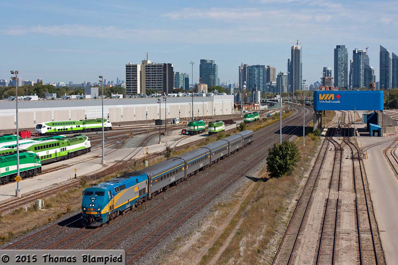 A visit to the GO Willowbrook and VIA TMC facilities never goes unrewarded. As VIA 73 rolls by on its way to Windsor, the latest addition to GO Transit's fleet sits in the background. One of the first of the newly-designed GO cab cars, number 303, is paired with GO 665 for crew training. The new cab cars feature improved visibility and crashworthiness. Of course, they also feature the unpopular two-tone green paint scheme of GO's new corporate image.