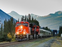 CN ET44ACs 3012 and 3013 speed across the Snaring River at Henry House with Edmonton bound train P617.