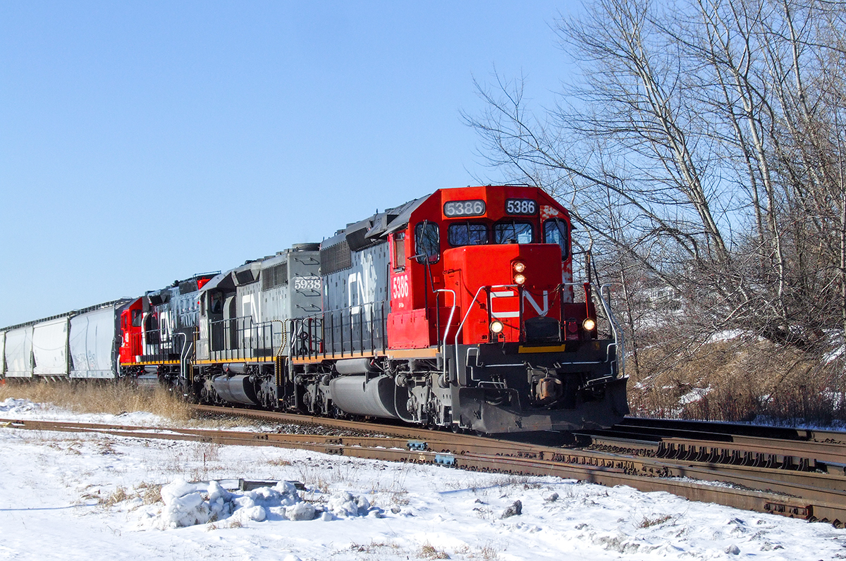 CN SD40-2 5386, GTW SD40-3 5938 and DMIR SD40T-3 408 coast through Port Hope with train M362.