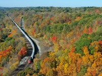 With word that the triple crown roadrailer service being discontinued, I made my way up to Dundas Peak after seeing Ryan Gaynor's fantastic shot from the previous day. So, here is CN Q14461 11 coasting down the Dundas Sub with a single SD75I keeping 6,838 ft of train in check .