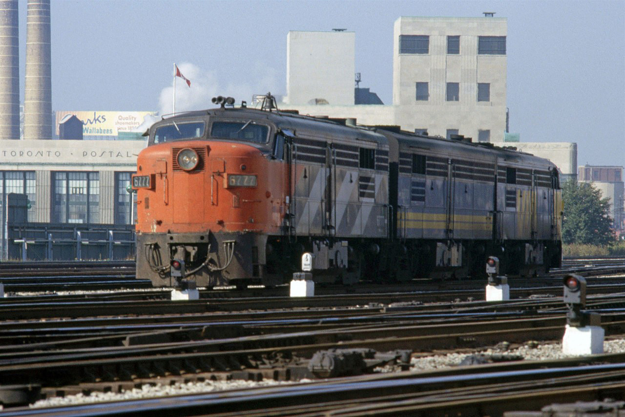 3 MLW units seen at the east end of the station. The 6777 remained in the CN colours for another year or two, I believe. I would see it periodically in Halifax in 1981.
VIA 6870 and 6771 are the other two locomotives.