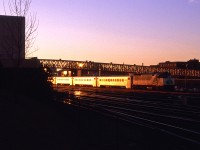 At 1700hrs a GO train heads west under the CN Tower walkway bridge. 
