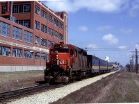 The high speed CN GP-40's became the regular power on the noon hour westbound VIA train. It would be led by 4016 or 4017.
The Art Deco building in the background is a tire manufacturing outfit. 