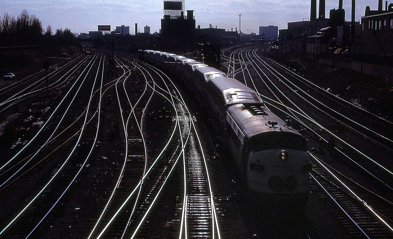 The Afternoon light reflects off an eastbound Lakeshore GO train as it passes Cabin D as it nears TUS.