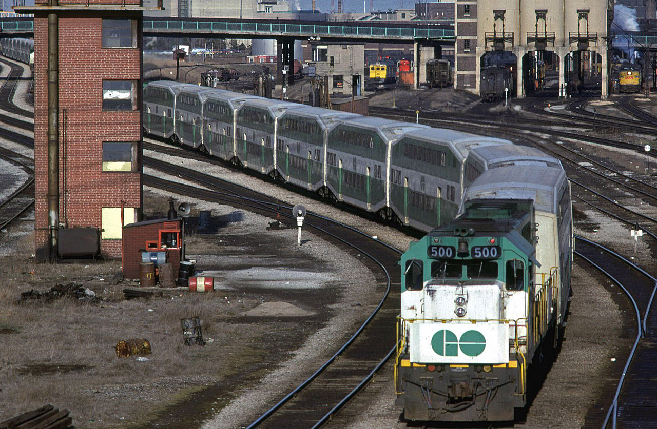 Yes, another eastbound GO train. It is 1652 hrs on April 18 1980. No wide cab units or F-40's yet - at least not in this picture.
Spadina Shops and another Go Train are seen at the top of the photo.