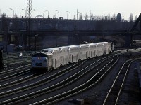 At 1726 hrs, 905 leads a GO train eastward to TUS.
Bathrust St bridge and the QEW are seen in the background.
All the tracks to the left of 905 are for the Coach Yard and the leads to the Spadina Shops.