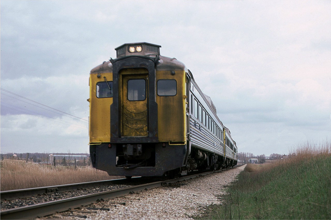 This is what VIA RDC's looked like in the Spring. The CN orange would be almost black.
The slide indicates that the train is eastbound and that it was taken in Kitchener, but I do not know where it was taken, but it might have been west of Glasgow St.