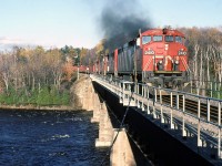 CN 305 hits the bridge with a brand new GE on the lead.