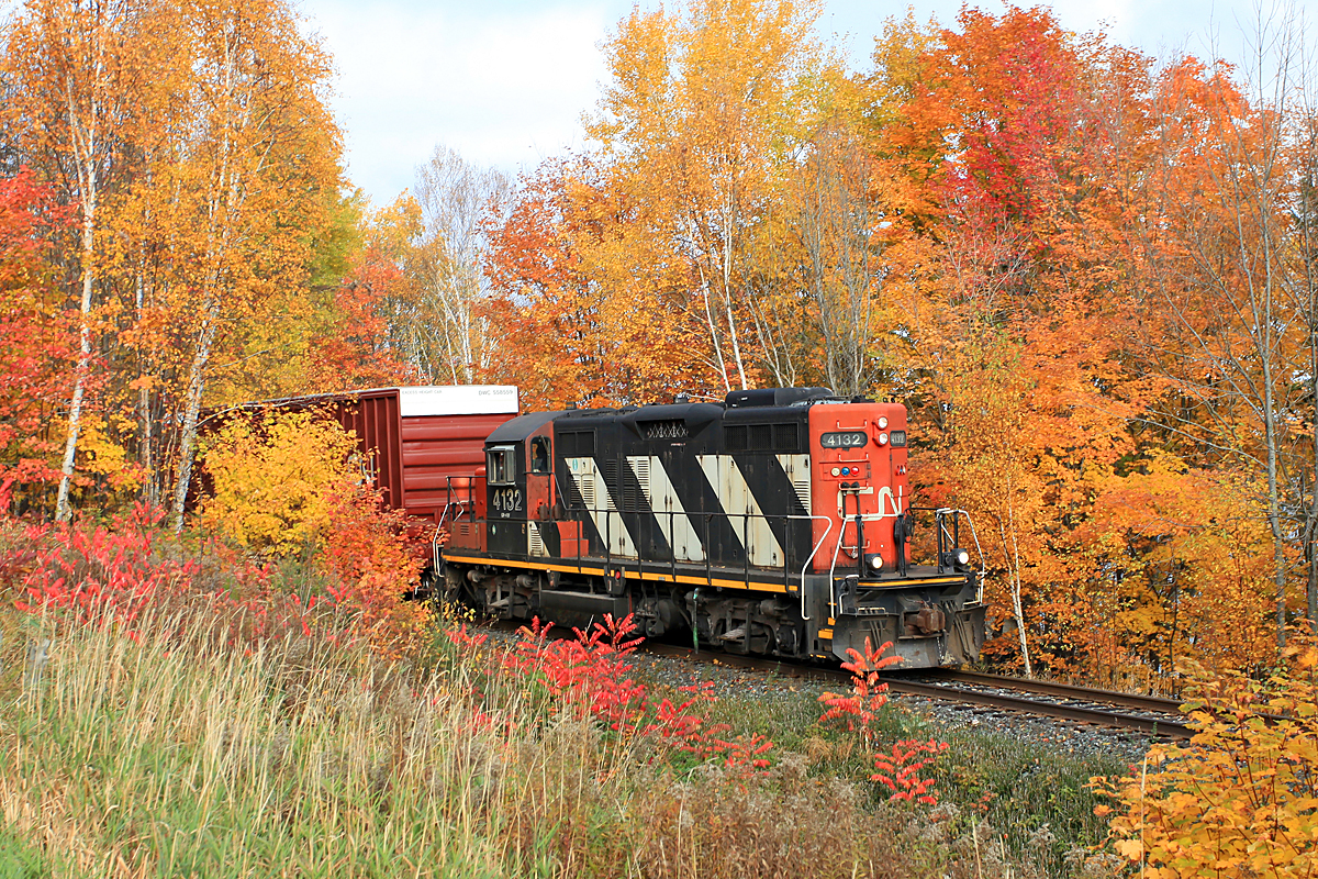 CN 4132 peeks through the fall foliage along Aspdin Road, just west (timetable south) of Huntsville on a brisk October morning.