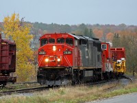 CWR train rolls southbound through Huntsville, returning from North Bay and area on a cold and rainy day.