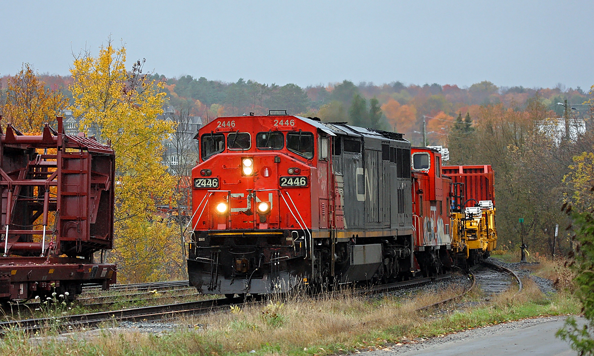 CWR train rolls southbound through Huntsville, returning from North Bay and area on a cold and rainy day.