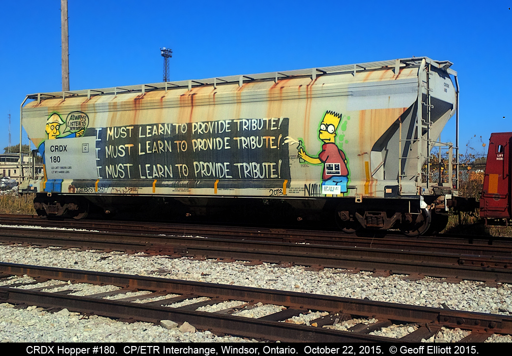 "The Simpsons" invade the Essex Terminal on the side of CRDX Hopper #108 as it sits on the CP/ETR Interchange track alongside the CP Windsor Yard.  Principal Skinner is telling Bart to "Always listen to Jersey Joe" whoever that is.  Thought the car was worth the shot....  :-)