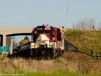 OSR 1620 and 6508 head under Hwy 401 and are about to cross Putnam Rd on with a box car for Messenger Freight Services and some tanks for Factor Gas Liquids.