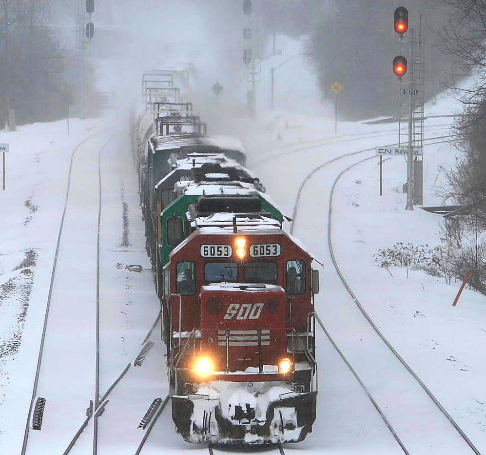 Saturday March 8 2008...the beginning of March break...except the masses were having trouble exiting at the airport due to a snowstorm covering the region.....Although CP 255 has no trouble making its way out onto the CN with SOO 6053 and two leasers trailing. No one else was on the walkway this day : )
