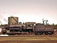 The late Mr. Del Rosamond was a history enthusiast and an active volunteer at the Champlain Trail Museum in Pembroke.  What I find ironic is that he seldom dated his slides or provided any additional details.  Perhaps he never considered that his photography would be admired as a beautiful and historical collection of images documenting the final days of Canadian steam.  I suspect that he never would have imagined that this small portion of his portfolio would have 130,000 internet page views in just a year.
<br />
<br />
Shown here is Consolidation-type M4g,  #3528.  The Consolidation had a relatively small firebox and driver wheels no larger than 63”.  This limited both the steaming capacity and speed.  
<br />
<br />
This image probably dates around 1959.  I don’t recognize the location, but I’m pretty sure it isn’t Pembroke.  Internet research shows that this locomotive was maintained in North Bay, so that’s my guess.  Please add a comment if you can confirm the location
