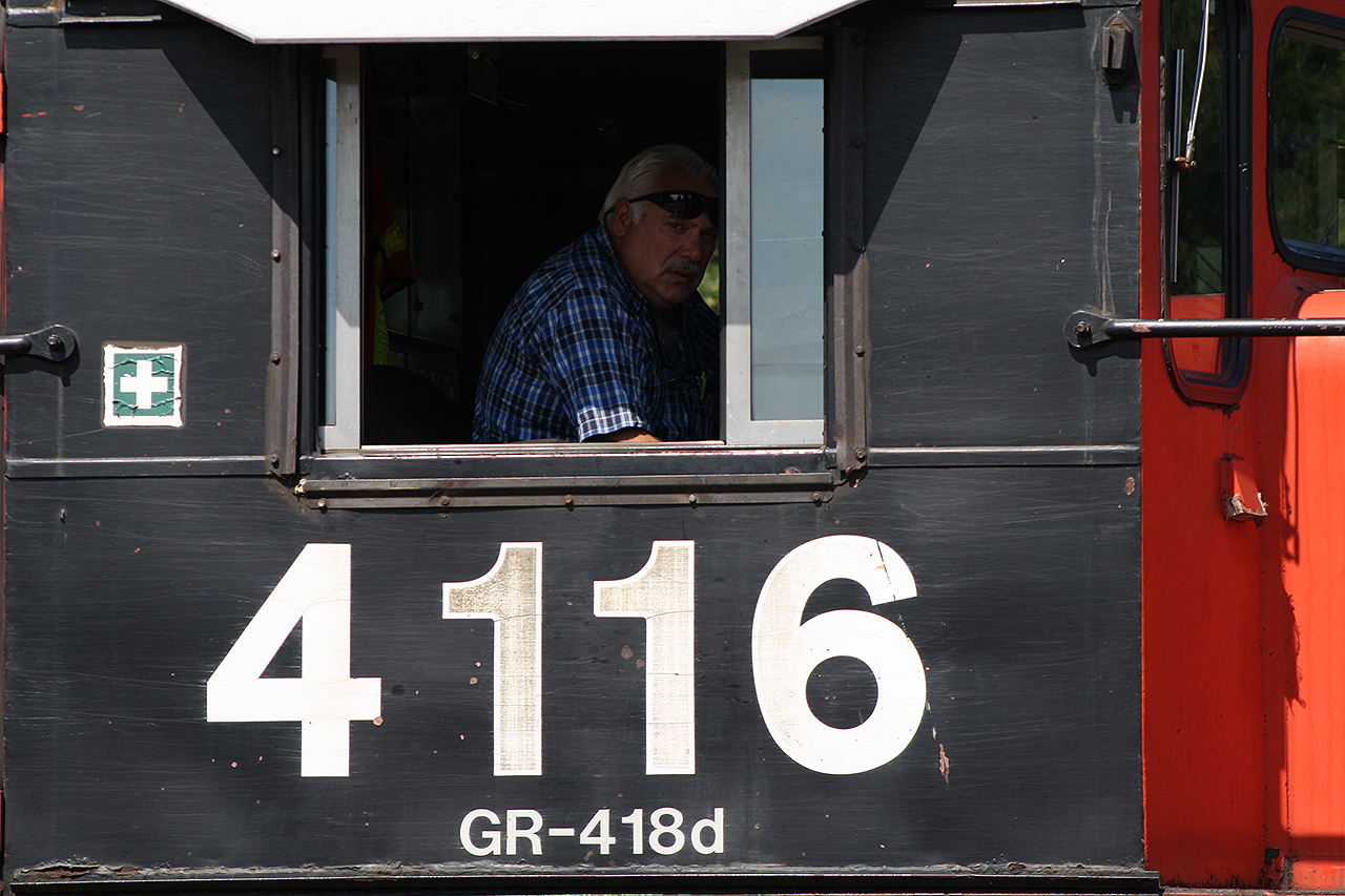PEEKABOO!  The crew aboard CN 4116 was just finishing their assignment in the Brantford yard, although the engineer seemed unimpressed as I took his photo.