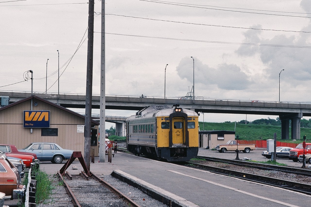 The little trains that did.


Via Rail train # 161 readies to depart*  Ste-Foy for Gare du Windsor.


Throughout the mid eighties  all Quebec City trains terminated / originated at Ste- Foy due to road and related construction near the Gare du Palais.


For two plus decades, the seventies under the CP Rail flag (trains #151 to #156) and the eighties under the VIA flag (#159 through #164), the CPR / CP Rail  Budd Cars shuttled the 175 north shore CP Rail  miles  six times a day between Gare du Palais  and  Gare du Windsor.


 Notably, by eliminating some intermediate stops  CP Rail scheduled ( 1976 timetable)  the single Budd Car  trains #152 and #154  at 3 hours for the 175 mile run including FIVE intermediate stops! That is an average  58.7 m.p.h. !


 (  as a comparison  the CN  Rapido, with multiple road (cab) units,  Bonaventure to Union, scheduled 5 hours for 335 miles including TWO intermediate stops ( 1969 timetable)  for an  average 67 m.p.h. )


( * or is this #160 arriving?  Either way those are Via Rail train numbers that have not been seen for decades! )


At Ste- Foy, P.Q., June 26, 1984,  Kodachrome by S.Danko.


P S [ So it is with some amusement that October 2015 VIA decides to 'test' Budd Cars out of Ottawa ! (  although arguably some Via Rail crews probably have never seen nor know what a Budd Car is !! ]