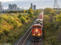 On a beautiful Fall evening, the daily Chicago-Montreal intermodal train makes its way through Bowmanville next to the St-Mary's Cement Plant. 