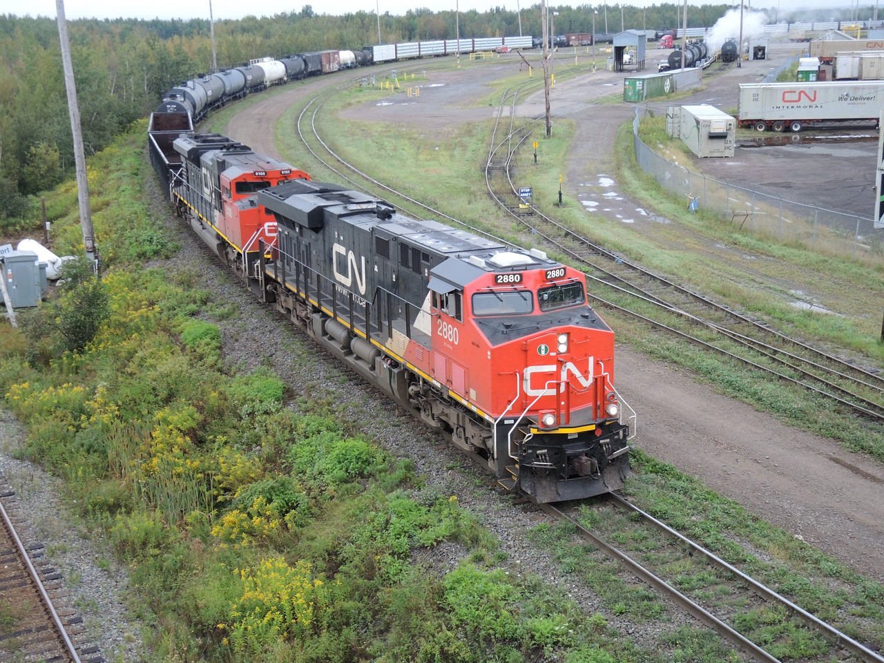 Road crew picked up cars from Moncton yard doubling back onto to train.