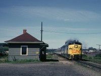 A few minutes after making its station stop in Truro Via #12 blasts past the station in Brookfield, Nova Scotia. FPA-4 6768 is wearing the early Via Rail paint scheme with the yellow pilot, angled yellow paint on the side of the nose and the CN logo on the nose.