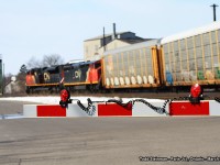 <b> LIGHTS...CAMERA...ACTION!!! </b> At the Market Street crossing, there were plenty of lights halting traffic as this westbound freight rolls around the bend through Paris Junction, mostly hauling auto racks in it's consist. 