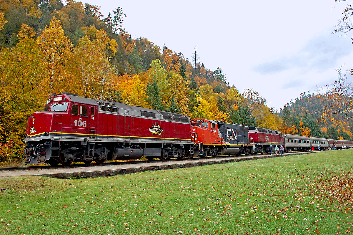CN 106, 4796 & 105 with an 18 car Agawa Canyon Tour train consist at Agawa Canyon Park on the last run of 2015. The Coalition for Algoma Passenger trains is trying to find a new operator, in the meantime with regular passenger service halted and CN failing to make any announcement about running the tour train in 2016, the future of any form of passenger service on this line appears very much in doubt. The root cause of this deplorable situation: the Federal Conservatives' decision that the train did not qualify for the remote rail program - in spite of a complete lack of roads much less any other form of public transportation in many of the locales served by the train. 

Passenger Rail - in spite of receiving less than 1% of the spending given to other modes http://www.comt.ca/english/statistics.pdf - is constantly under attack by so-called fiscal conservatives who claim we’re spending too much on trains. Why? Because of slight-of-hand misinformation by highway/aviation special interests to keep you focused on the flea instead of the elephant.

As we head to the polls, those who support passenger trains should remember the federal governments' decision to cut ACR's, as well as VIA's, meager funding leaving people stranded in towns with no other form of public transportation, all while spending billions on roads, marine terminals, airports, sidewalks ect, which aren't expected to pay their own way much less operate at a profit. Here's to making our vote count October 19.

Check out my website at  http://northamericabyrail.info  , Cheers, Pete