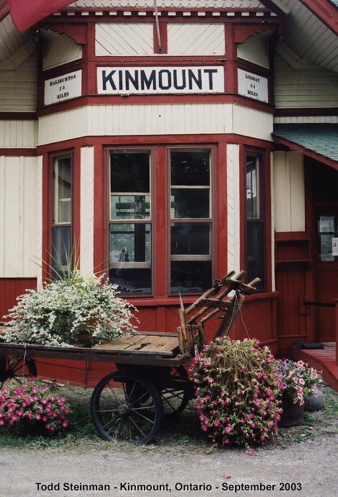 This photo was taken on my first trip to Kinmount. I never really realized it at the time, but I saw something that day. Now looking at this photo, I never realized how centred everything was around the bay window at the front of the station. Everyting is perfect...flowers, wagon and all!  The station was beautifully painted in GTR (or CN) colours amd had been restored shortly after the rails were pulled up around 1984-1985. At one end of the station, you could visibly tell that the foundation had crumbled, as it caused the station to sag. On my last trip to Kinmount in 2008, the foundation was fixed, and a wooden ramp was added to the front of the station for wheelchair accessibility. This station has stood the test of time.