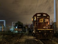 <b>Gone to beans.</b> The crew of the Dorion Turn has left their train near the Lafleur Avenue crossing and gone to grab dinner. At left is the spur for Total Canada, one of two clients remaining on the once busy CP Lasalle Loop.