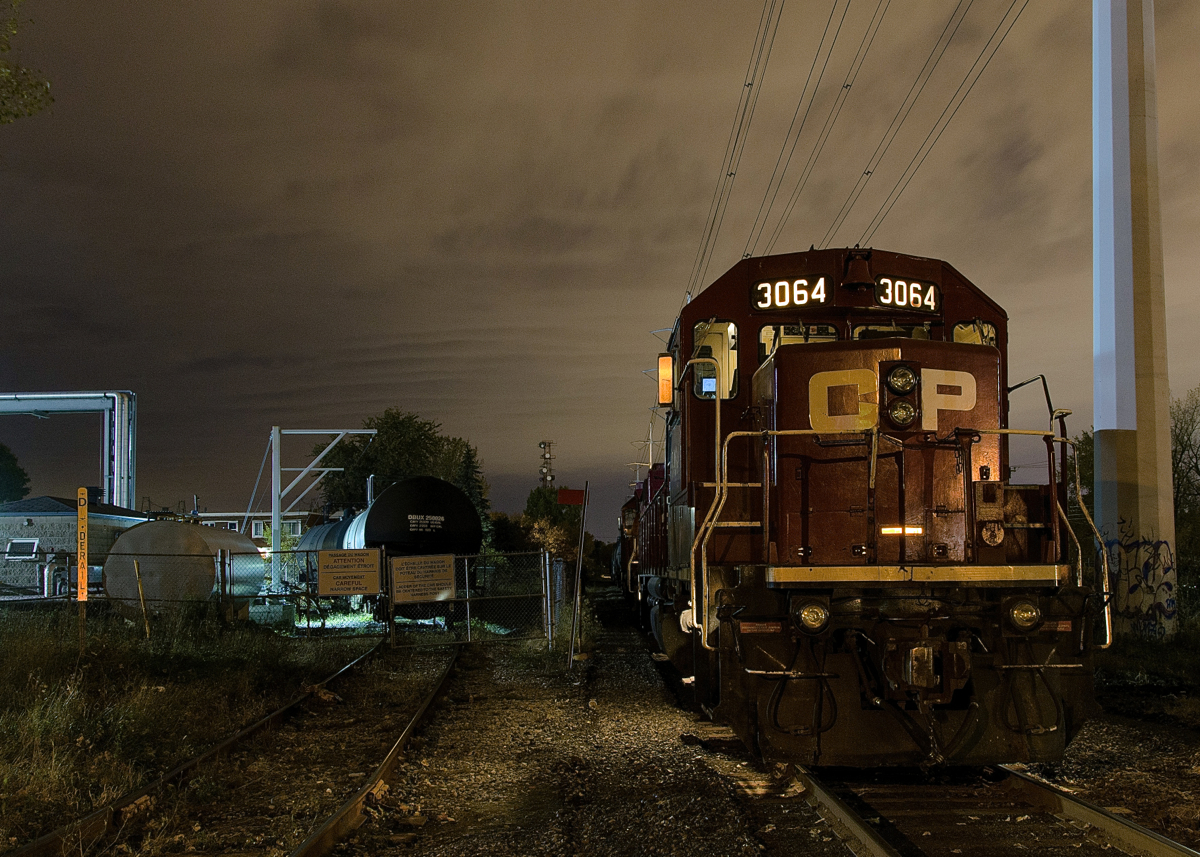 Gone to beans. The crew of the Dorion Turn has left their train near the Lafleur Avenue crossing and gone to grab dinner. At left is the spur for Total Canada, one of two clients remaining on the once busy CP Lasalle Loop.