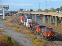 <b>Dirty, somewhat clean and very clean.</b> GE's in descending order of cleanliness (IC 2704, CN 2839 & CN 3036) lead CN 120 by MP 6 of CN's Montreal sub, passing the now closed Lachine spur at left.