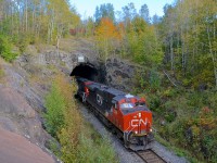 <b>Exiting the Shawinigan tunnel.</b> After picking up cars in interchange from the Quebec Gatineau in Shawinigan, CN 461 is headed for Montreal as it passes through the Shawinigan tunnel with CN 2334 leading.