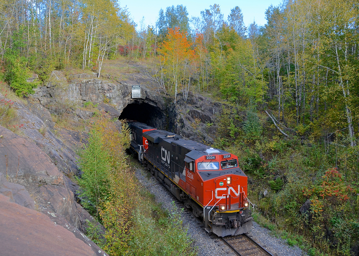 Exiting the Shawinigan tunnel. After picking up cars in interchange from the Quebec Gatineau in Shawinigan, CN 461 is headed for Montreal as it passes through the Shawinigan tunnel with CN 2334 leading.