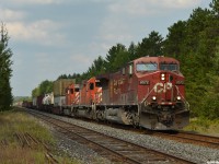CP 420 blasts through Essa with CP 8572/CP 5765/DME 6089 (originally CP 5533) and 85 cars, including 24 on the tail end for Spence. Just ahead they'll lose about an hour in the siding at Baxter waiting for counterpart 421 to finish his work at Spence before they can get their turn into the yard. 