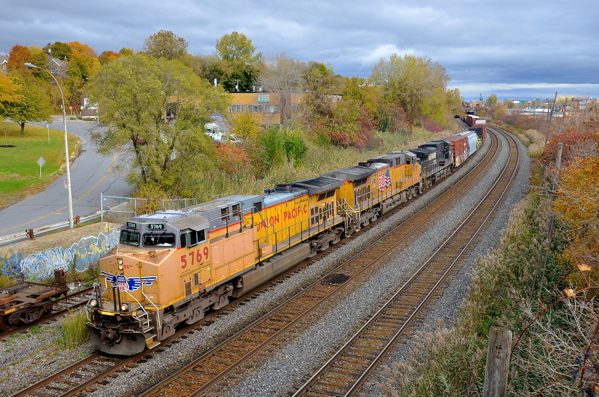 Two UP AC4400CW's in Montreal. About 24 hours after arriving in Rouses Point, NY as CP 931, CN 529 has arrived in Montreal with two UP AC4400CW's leading an NS Dash9 (UP 5769, UP 5615 & NS 9166) as it passes through Montreal West on its way to nearby Taschereau Yard.