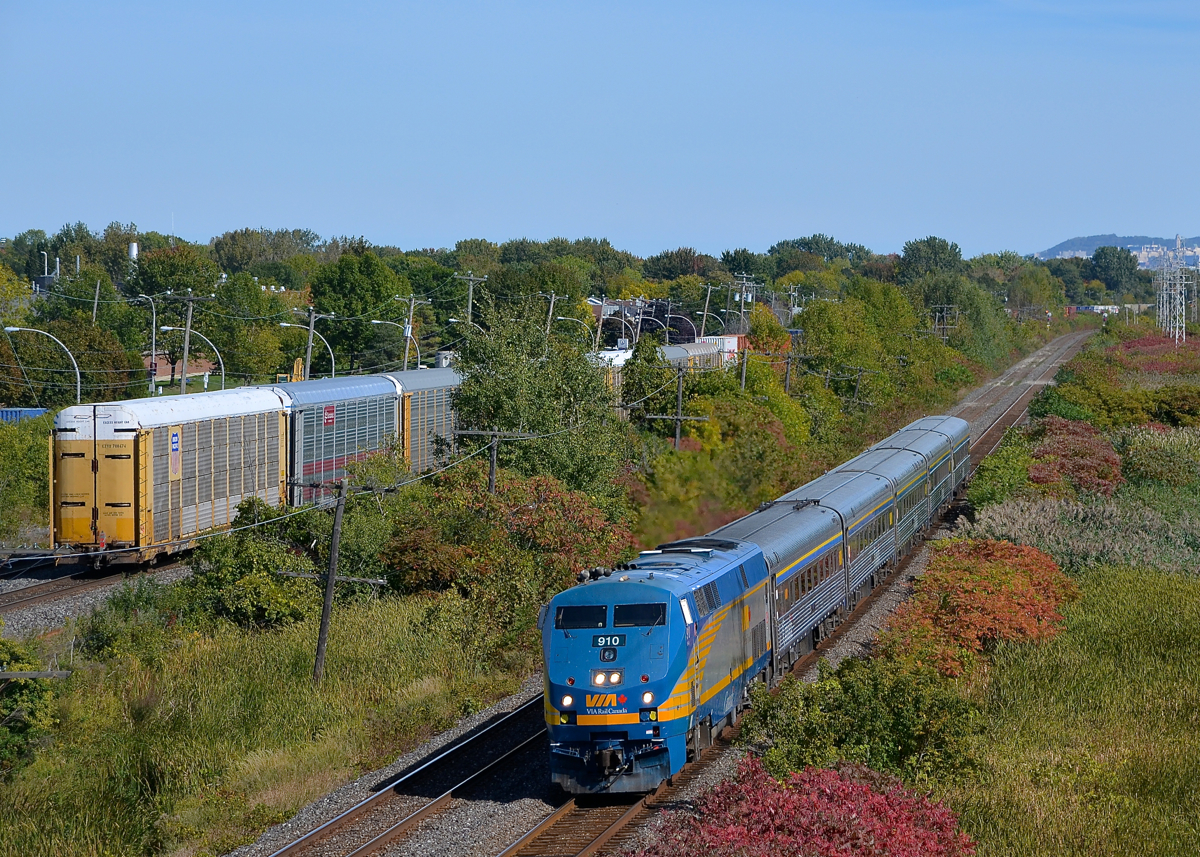 VIA 55 and CP 112. VIA 55 is westbound on CN's Kingston Sub as the tail end of CP 112 passes on the parallel CP Vaudreuil Sub