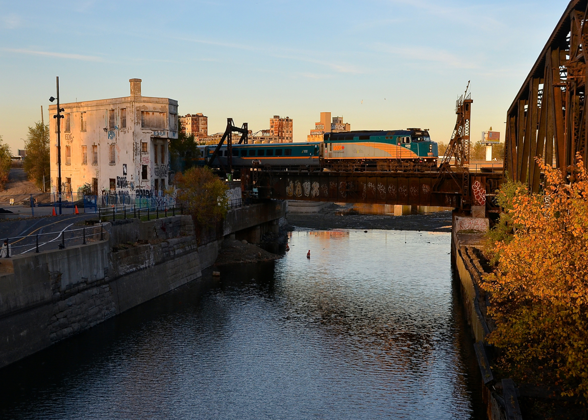 Last light. It's about 45 minutes before sunset and there's still enough sun (barely) to illuminate VIA 6409 as it leads VIA 37 past the Wellington tower and over the partially drained Lachine Canal.