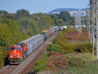 <b>The usual pair of ES44AC's.</b> CN 377 has the now customary pair of ES44AC's (CN 2851, CN 2927) as it heads west through Pointe-Claire early in the afternoon.