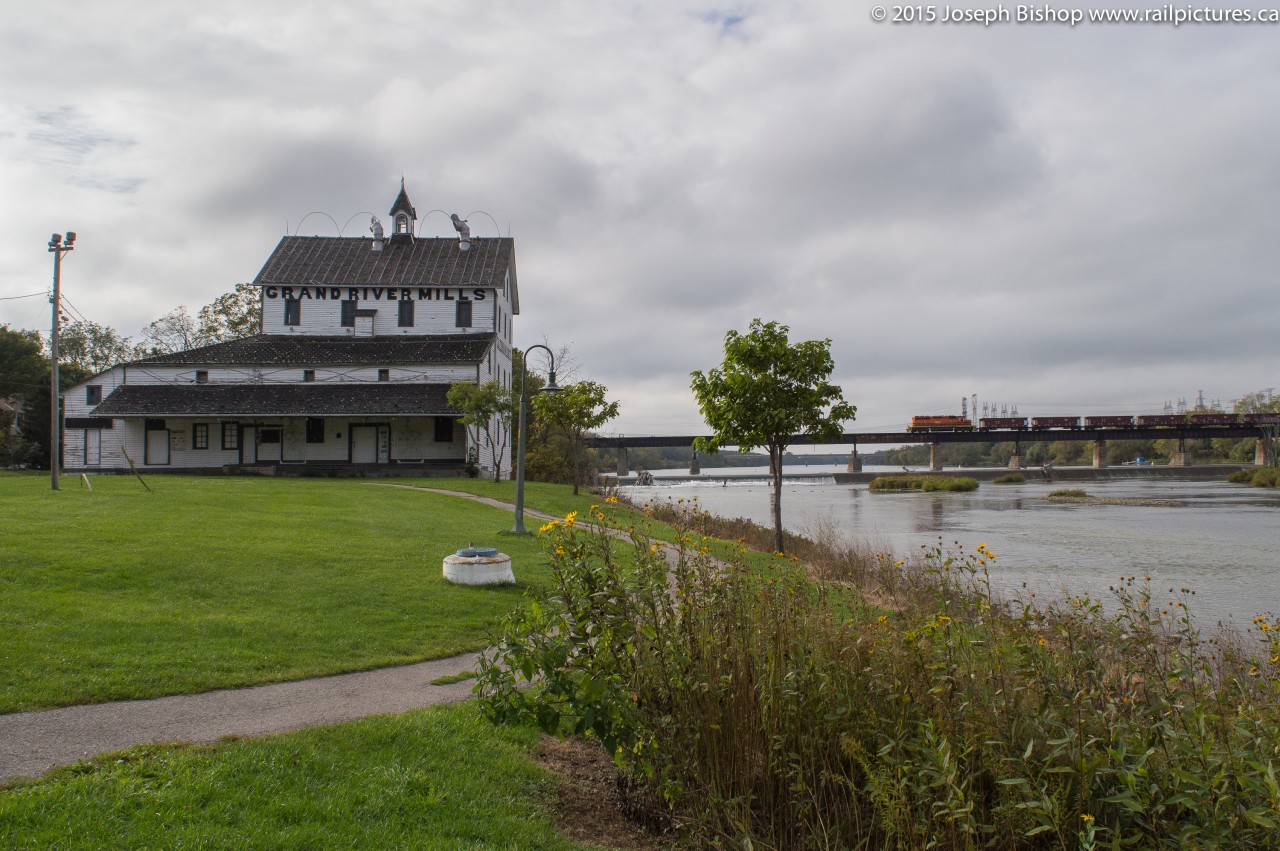 Built in 1853 the Caledonia Mill was operational processing wheat into flour from 1857 until roughly 1960.  In 1983 after the mill had changed hands many times it was granted heritage significance status.  Today it is owned and taken care of by Caledonia Old Mill Corporation.  The past couple of years it has featured a Christmas light show though after this past winter the light show has ended and the future of the old mill is uncertain.Pictured is RLHH 599 crossing the Grand River this afternoon with RLHH 3403 and 9 empty ballast cars.  They were dropping ballast along the Hagersville Sub near Cainsville this afternoon before returning to Garnet.