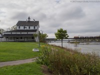 Built in 1853 the Caledonia Mill was operational processing wheat into flour from 1857 until roughly 1960.  In 1983 after the mill had changed hands many times it was granted heritage significance status.  Today it is owned and taken care of by Caledonia Old Mill Corporation.  The past couple of years it has featured a Christmas light show though after this past winter the light show has ended and the future of the old mill is uncertain.<br><br>Pictured is RLHH 599 crossing the Grand River this afternoon with RLHH 3403 and 9 empty ballast cars.  They were dropping ballast along the Hagersville Sub near Cainsville this afternoon before returning to Garnet.